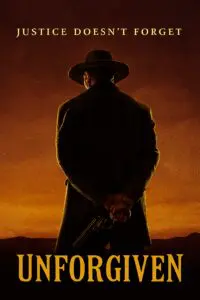 Silhouette of a person in a hat holding a gun against a sunset.